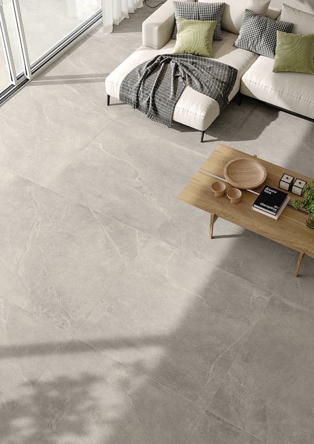 Large-format neutral floor tile in a contemporary living room